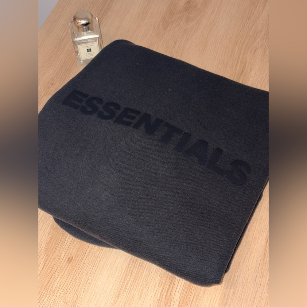 fear of god essentials black zip up